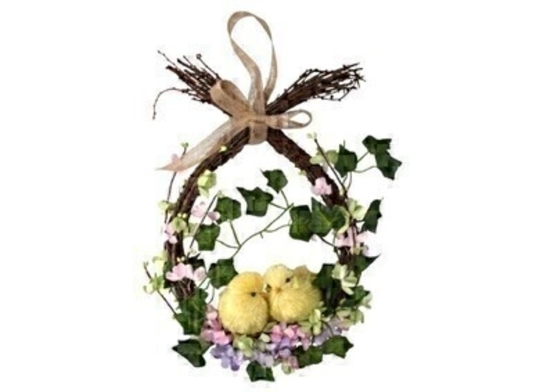 Easter wreath with twigs and artifical flowers and yellow chicks to hang on your door or to decorate your house this Easter. This wreath design comes from designer Gisela Graham who makes unique Easter gifts. This eatser decoration would make a lovely Easter gift.